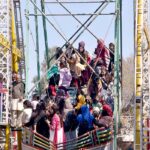 Girls enjoy swings during cultural show at GCWUS.