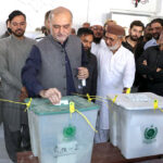 Ameer Jamat e Islami Karachi Hafiz Naeem ur Rehman casting his vote in the polling station during General Elections 2024