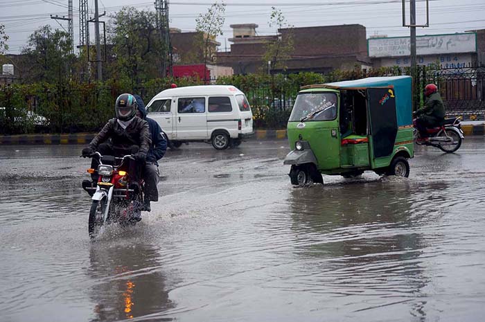 Vehicles passing through stagnant rain water accumulated at Haji Camp GT road.