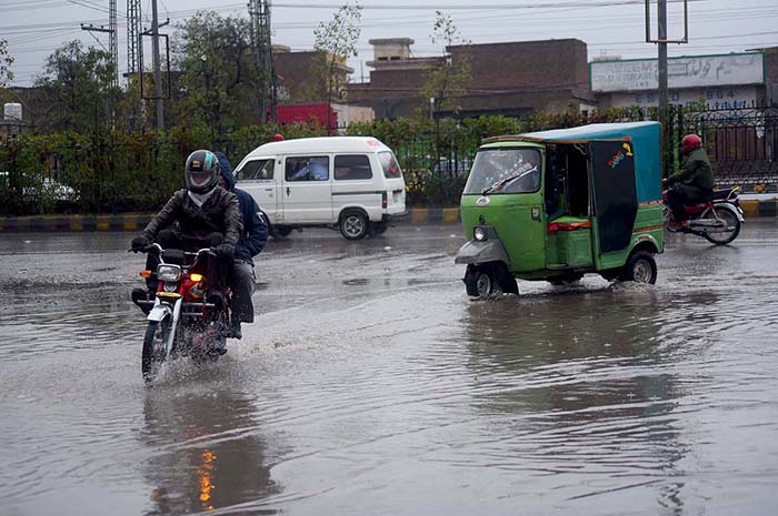 Vehicles passing through stagnant rain water accumulated at Haji Camp GT road. Vehicles passing through stagnant rain water accumulated at Haji Camp GT road.