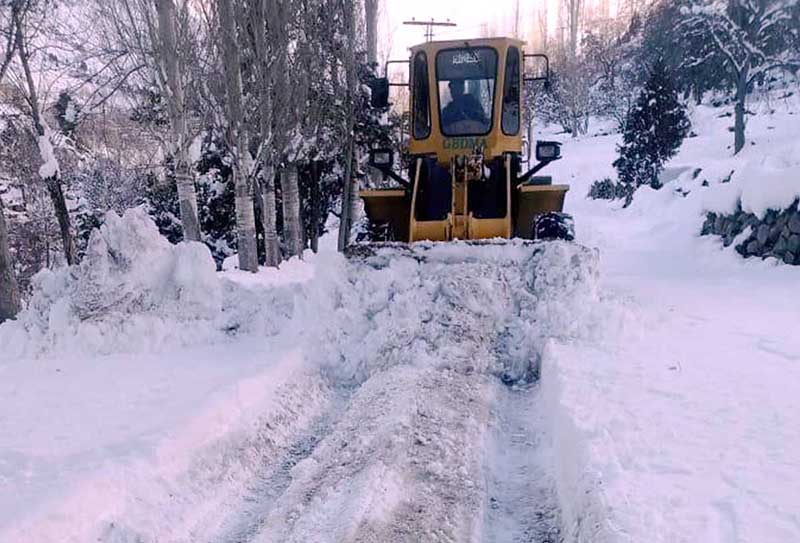 Heavy machinery being used to remove snow from road by GBDMA and Works department Gilgit-Baltistan