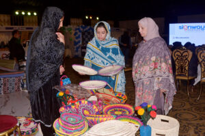 Visitors taking interest in the displayed stuff on a stall during the Bleu fair organized by the Women Chamber of Commerce