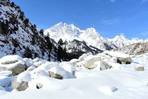 An attractive view of Naltar Valley covered by fresh snow on the mountains.