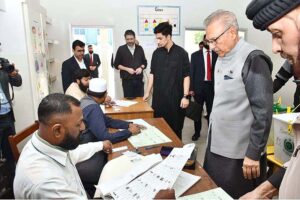 President Dr. Arif Alvi waiting to receive ballot paper in polling station during General Election-2024