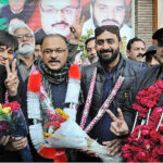 Independent candidate Malik Amir Dogar with supporters celebrates after winning the election for National Assembly constituency NA-149 Multan-II according to unofficial result.