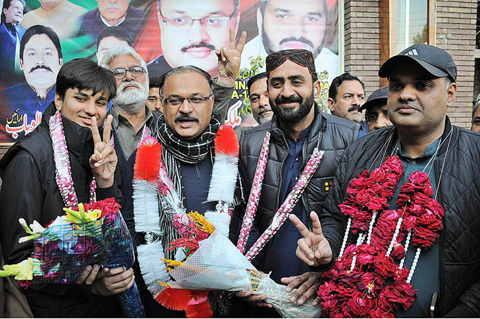 Independent candidate Malik Amir Dogar with supporters celebrates after winning the election for National Assembly constituency NA-149 Multan-II according to unofficial result.