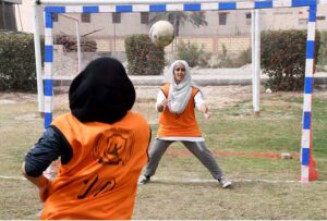 Players of different Colleges in action during trials for Larkana Region Girls Handball teams in connection with the Prime Minister Youth Sports League, organized by HEC at Shaheed Mohtarma Benazir Bhutto Medical University.