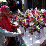 Children viewing traditional toys on a stall during Punjabi Language Day at the Press Club