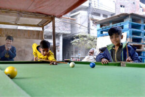 Children playing snooker at a local Snooker Club near Shadra