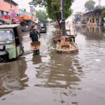 A view of rain water accumulated on the railway station road after rain in the city