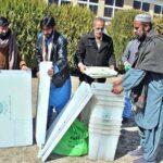 Polling staff receiving polling material at distribution Centre for General Elections 2024.