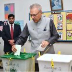 President Dr. Arif Alvi waiting to receive ballot paper in polling station during General Election-2024