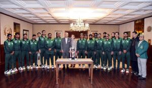 President Dr Arif Alvi, in a group photograph, with players and management of the Pakistan Blind Cricket team at Aiwan-e-Sadr