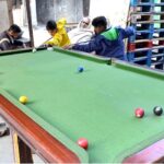 Children playing snooker at a local Snooker Club near Shadra