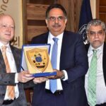 President Chamber of commerce Abdul Ghafoor Malik presenting a shield to Dr. Rudiger Lotz, Consul General at SCCI