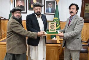 Chief Minister Gilgit-Baltistan Haji Gulbar Khan giving away shield to Retired Secretary Excise and Taxation GB Momin Jan at CM Secretariat.