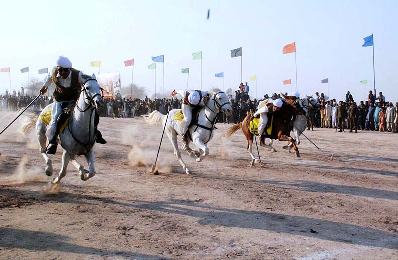 Horse riders aiming their target in the Tent Pegging Competition during 19th TDCP Cholistan Desert Rally 2024 at Cholistan desert Jeep Rally