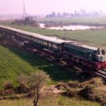 A beautiful view of passenger train passing near bypass road