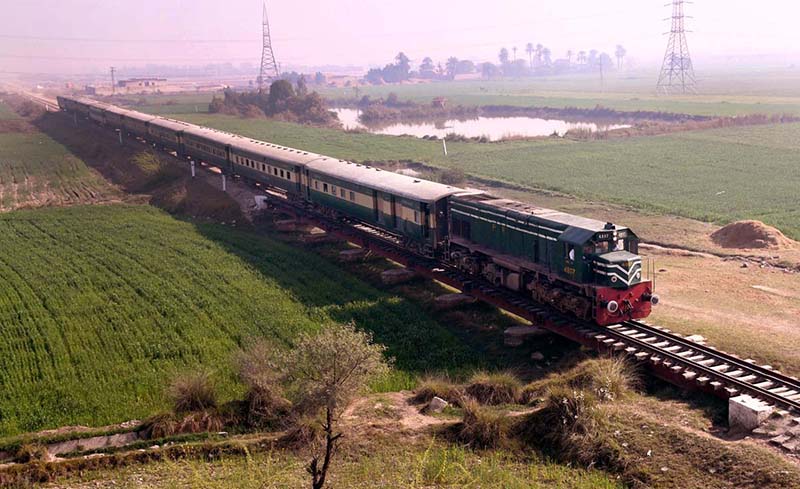A beautiful view of passenger train passing near bypass road