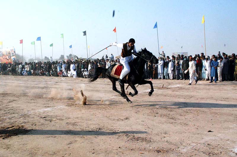 Horse riders aiming their target in the Tent Pegging Competition during 19th TDCP Cholistan Desert Rally 2024 at Cholistan desert Jeep Rally