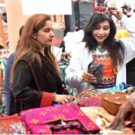 Women taking Selfie during winter Festival at Al Hamra Cultural Complex