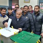 PML-N President Shehbaz Sharif giving thumb impression on ballot paper in Model Town polling station during the General Election-2024