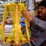 Vendor busy in making traditional mehndi thaal used in wedding events at Fawara Chowk