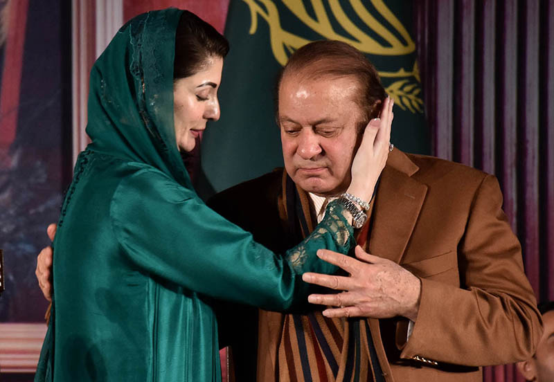 Newly-elected Chief Minister Punjab Maryam Nawaz gives congratulatory hug to her Father Former Prime Minister Nawaz Shareef after taking oath at Governor House