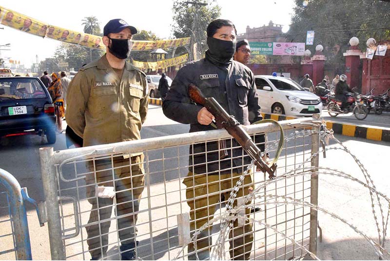 Police officials standing alert outside the polling station during General Election-2024