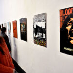 Visitor viewing the art exhibition on Kashmir Solidarity day at National College of Arts