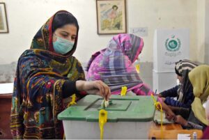 A female voter casting her vote in Queen Mary College Polling Station during General Election-2024
