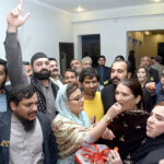 PML-N workers distribute sweets among the supporters to celebrate the success of PML-N leader Maryam Nawaz in General Elections-2024 at Model Town