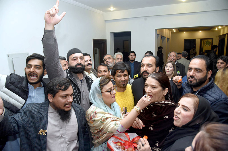 PML-N workers distribute sweets among the supporters to celebrate the success of PML-N leader Maryam Nawaz in General Elections-2024 at Model Town