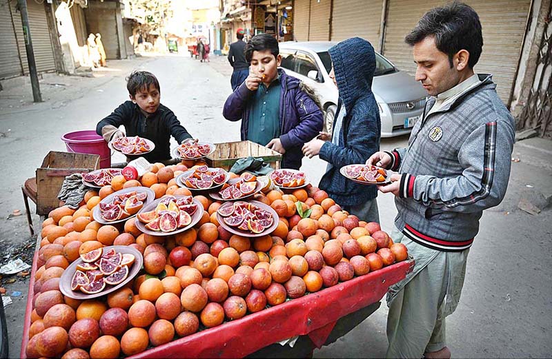 A vendor displaying and selling oranges to attract the customers at People Mansi area