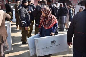 Polling staff receiving polling material at distribution Centre for General Elections 2024.
