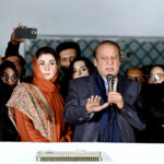 Pakistan's former Prime Minister and leader of the Pakistan Muslim League (PML-N) , Nawaz Sharif along with his brother, Shehbaz Sharif and his daughter Maryam Nawaz, speaks with supporters at Model Town