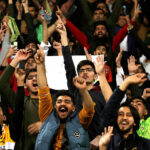 Spectators enjoying during the Pakistan Super League (PSL) Twenty20 cricket match between Lahore Qalanders and Karachi Kings at the Gaddafi Cricket Stadium