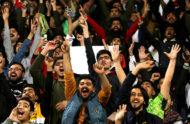 Spectators enjoying during the Pakistan Super League (PSL) Twenty20 cricket match between Lahore Qalanders and Karachi Kings at the Gaddafi Cricket Stadium