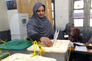 A female voter casting her vote in Queen Mary College Polling Station during General Election-2024