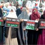 Women workers of Jamaat-e-Islami holding rally in front of the press club in support of Palestine