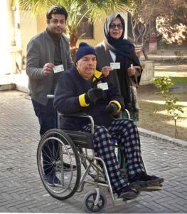 A female voter casting her vote in Queen Mary College Polling Station during General Election-2024