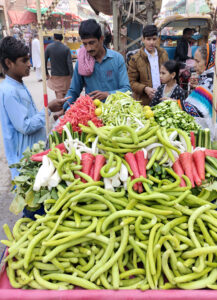 A vendor displays fresh vegetable salad to attract the customers