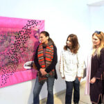 Women viewing artwork during the Lahore Literary Festival at Al-Hamra