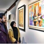 Visitors viewing the displayed stuff during Painting, Sculpture, Ceramic and Calligraphy Exhibition organized by Arts and Craft Forum at PILAC Gaddafi Stadium