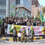 People participating in a rally to mark the Kashmir Solidarity Day outside Chiniot Bazaar