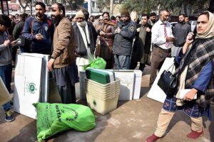 Polling staff receiving polling material at distribution Centre for General Elections 2024.