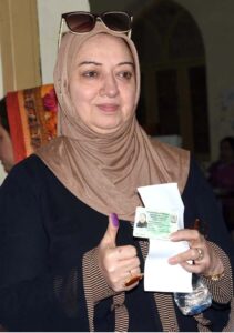 A female voter casting her vote in Queen Mary College Polling Station during General Election-2024