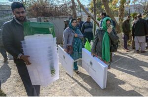 Polling staff on the way after receiving polling material at distribution Centre for General Elections 2024.