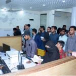 People receiving their passports at the passport office near Allied Hospital
