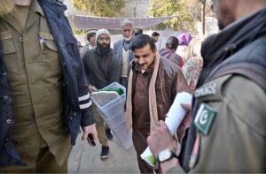 Polling staff on the way after receiving polling material at distribution Centre for General Elections 2024.